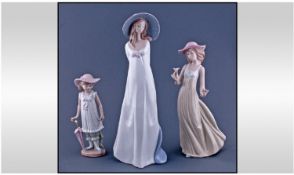 Collection of Four Nao by Lladro Figures, two with original boxes. Various poses and sizes.