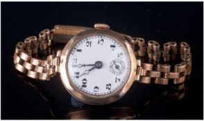 Ladies 9ct Gold Cased Mechanical Wrist Watch. Fitted to a 9ct gold plated bracelet. Circa 1920`s.