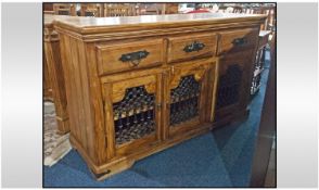 A Large Teak Dresser Base, consisting of three draws above, three cupboards base below, with