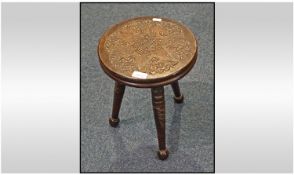 A Small Three Legged Round Carved Top Milking Type Stool. Height 13 inches, diameter of top 11