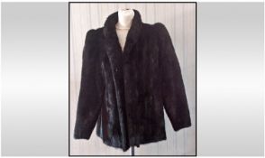 Ladies Short Length Dark Mink Coat. Fully lined. Hook and eye fastening, slit pockets. Approximate