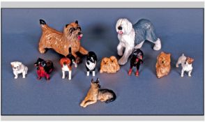 A Good Collection Of Beswick And Doulton Dog Figures. 11 in total. All in good condition. List as