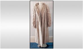 Ladies Long Length Fully Lined Mink Coat. With cuff sleeves and slit pockets. Hook and loop