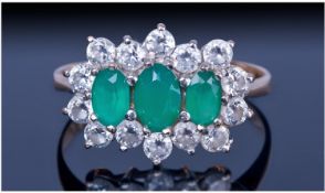 A 9ct Gold Set Emerald And Cubic Zirconia Dress Ring. Fully hallmarked. Travellers sample.