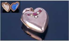 Victorian Heart Shaped Locket. The hinged front set with a row of alternating seed pearl and