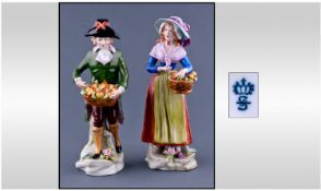 Sitzendorf Pair Of Fruit Sellers Figures. Hand painted in strong colours. Each figure 6.75 inches