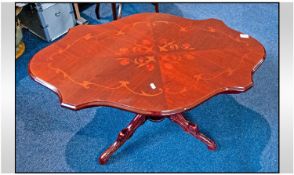 An Inlaid Shaped top occasional table with central turned carved column on four halved cabriole