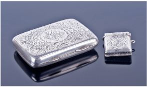 A Silver Cigarette Case. Hallmark Birmingham 1924. 68.1 grams. 3 x 2.25 inches. Plus a small silver