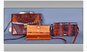 Three Crocodile Skin Handbags comprising clutch bag, shoulder bag and larger hand/shoulder bag.