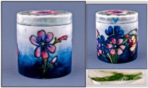 Moorcroft Signed Lidded Round Pot. Spring flowers design. Circa 1947-1957. Height 4 inches.
