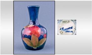 Moorcroft Miniature Bottle Vase. Pomegranate design. Circa 1930`s. Height 3.75 inches.