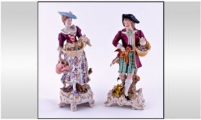 Sitzendorf Pair Of 19th Century Figures, in 18th century dress. Standing 8.5 and 9 inches high.