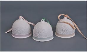 Three Lladro `Collector Society` Bells. 3.5 inches in height with pink, green and orange trim.