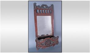 Edwardian Mahogany Stained Wall Mirror with comb box compartment.