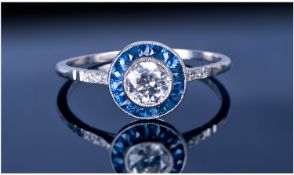 Art Deco Style 18ct White Gold Set Diamond And Sapphire Ring. The Pavee set central diamond of good