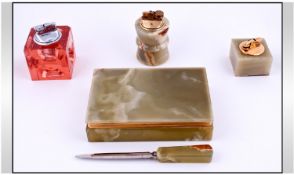 A 1960`s Collection Of Onyx Desk Accessories. Includes a letter opener, 2 table cigarette lighters,