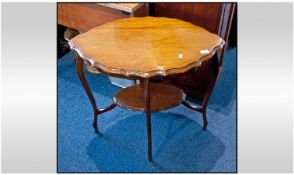 An Edwardian Walnut Shaped Top, Side Table, on cabriole legs supported by a platform centre.