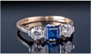 9ct Gold Set Three Stone Diamond And Sapphire Ring. The central sapphire of good colour. Flanked by