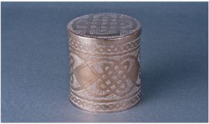 A Nigerian Silver Cylindrical Box With Pull Off Lid. Decorated throughout with knot work patterns