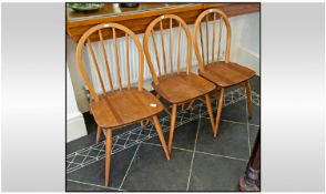 Three Ercol Stick Back Dining Chairs.