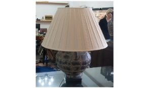 Archaic Style Table Lamp, with cream shade.