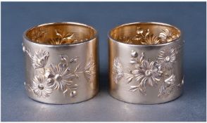 An Attractive Pair Of Silver And Silver Gilt Portuguese Napkin Rings. Embossed with flowering