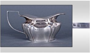 A Good Large Edwardian Silver Milk Jug of Angular and Canyoned Design. Hallmarked for Birmingham