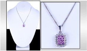 Ladies 18ct White Gold Pendant, with the central setting of 12 princess cut pink sapphires,