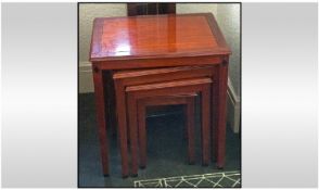 Nest of Four Hardwood Oriental Tables, With a high gloss finish on square tapering legs and