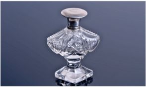 Art Deco Silver Topped Glass Scent Bottle. Of shaped form. The silver top hallmarked for Birmingham