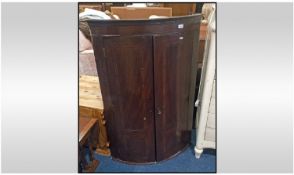 A Georgian Beau Fronted Inlaid Door Corner Cabinet. With three interior fitted shelves and two