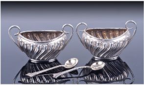 Victorian Pair Of Silver Two Handle Salts. With ribbed sides, complete with silver spoons. Hallmark