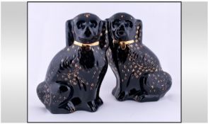 Two Black and Gilt Ceramic Flatback Spaniel Figures, 13.5 inches high.
