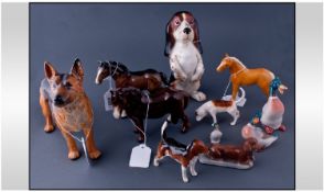 Collection Of 11 Porcelain Animal Figures comprising 2 Beswick hounds, Sylvac hound in standing
