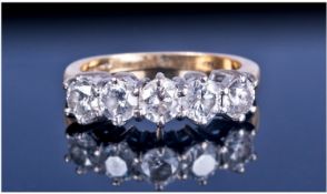 18ct Gold High Gallery Set Five Stone Diamond Ring. The diamonds of good colour and clarity.