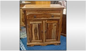 Teak Side Cabinet, with a draw above two cupboards. 13 inches deep, 30 inches wide, 35 inches high.