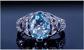 14ct White Gold Dress Ring, Set With A Central Blue Aquamarine Coloured Stone, Fancy Gallery Set