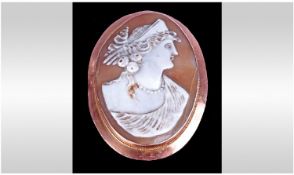 Victorian Large 9ct Gold Framed Shell Cameo. Of a classical maiden looking intently. Marked 9ct.