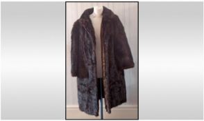 Ladies Dark Brown Fully Lined Knee Length Mink Coat. Half pelt to back. Hook and loop fasten. Good