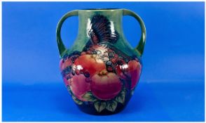 Moorcroft Modern Twin Handled Vase of Waisted Form, ` Finches ` Designer Sally Tuffin. Date 1990.