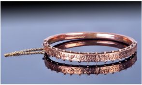 Victorian 9ct Rose Gold Bangle. With chased decoration. Hallmark Chester 1899. 8.9 grams.