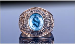 10ct Gold American Collage Ring. Set with central blue Faceted stone, marked South High School `84.