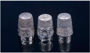 Three Silver Thimbles, Each With A Stylized Floral Girdle. Circa 1920. Unmarked but tests silver.