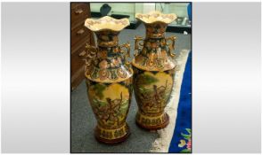 Pair Of Chinese Vases, profusely decorated with figures set in panels in floral border. 24`` in