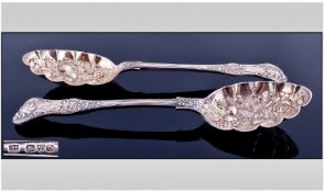 A Very Fine Pair Of Large And Embossed Preserve/Fruit Spoons. Gilt bowls. Hallmark Chester 1914.