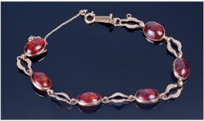 German 8ct Gold(333) Amber Set Bracelet, Six Oval Amber Beads In A Gold Setting Between Quatrefoil