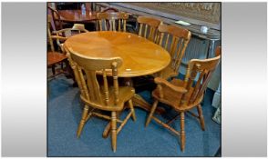 Modern Oak Coloured Dining Table and Six Chairs.