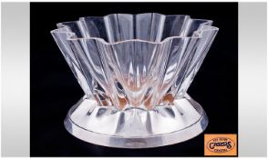 A Silver And Glass Crystal Fine Modern Art Form Hander Chief Vase, raised on a silver base.