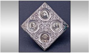 Victorian Embossed Silver Photo Frame Containing Four Pictures of Victoria and Her Children.