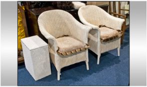 Two Lloyd Loom Tub Chairs, painted cream with fitted cushions.